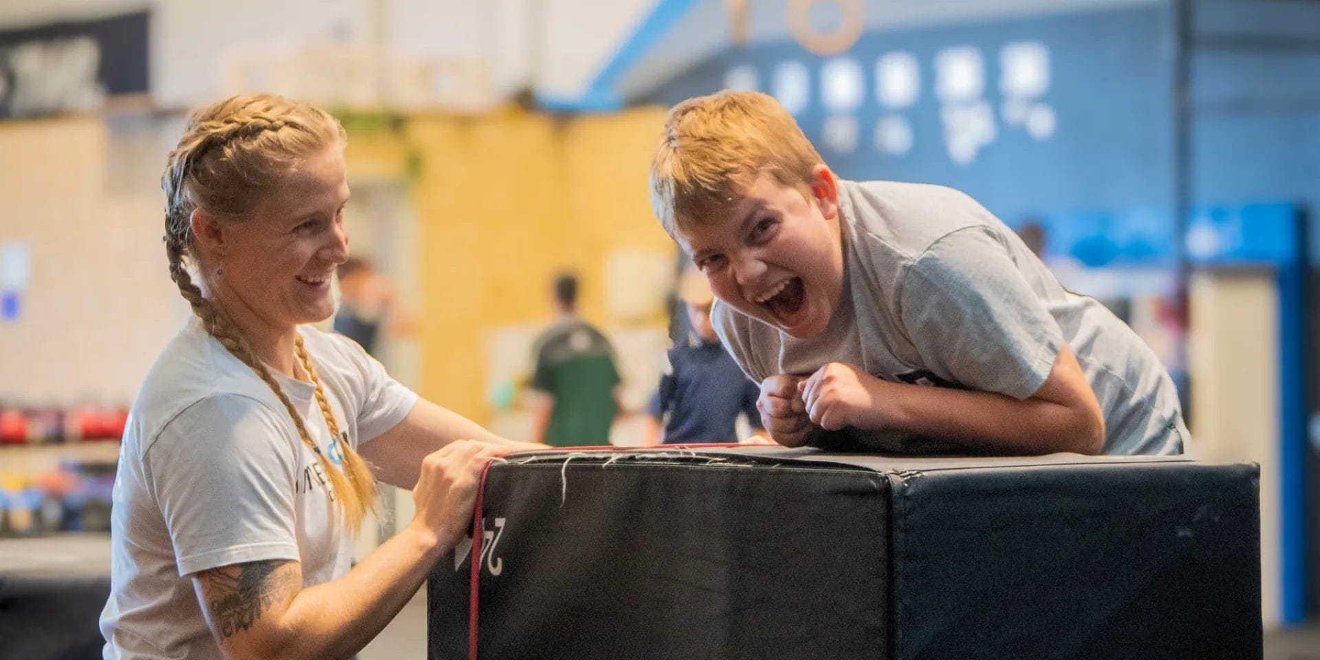 Smiling kid with coach