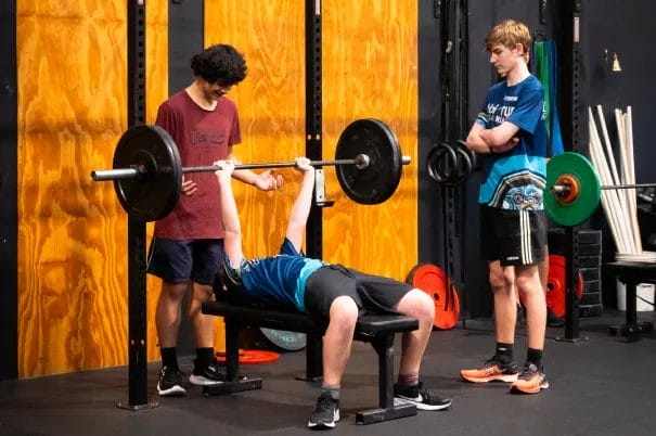 Innerbloom CrossFit Teens spotting each other
